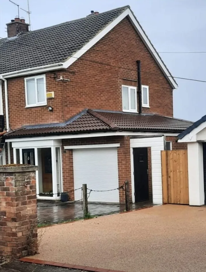 New tiled porch roof on a detached house