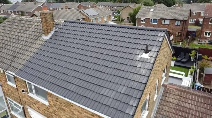 Aerial view of a new grey-tile re-roof on a semi-detached house