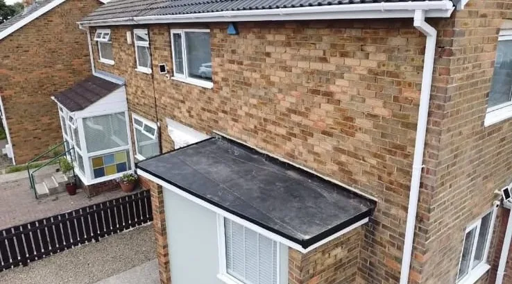 New rubber flat roof over a front bay extension